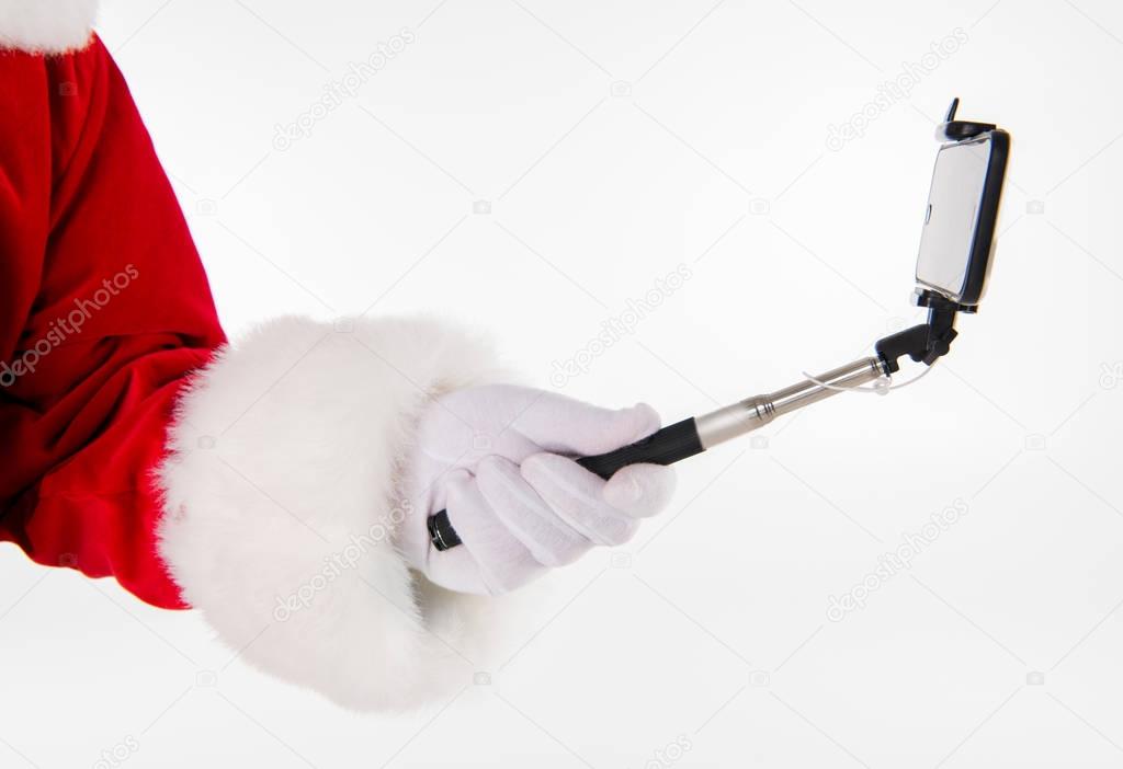 Santa Claus hand showing selfiestick