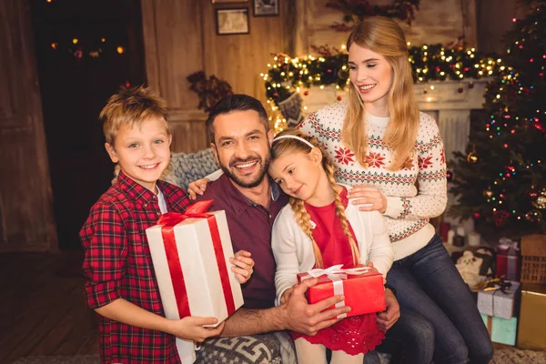 Happy family with christmas presents — Stock Photo, Image