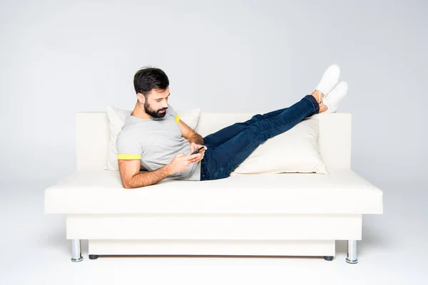 Bearded man using smartphone — Stock Photo, Image