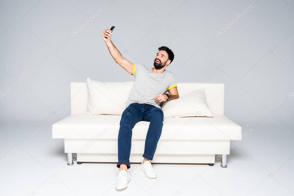 Bearded man taking selfie