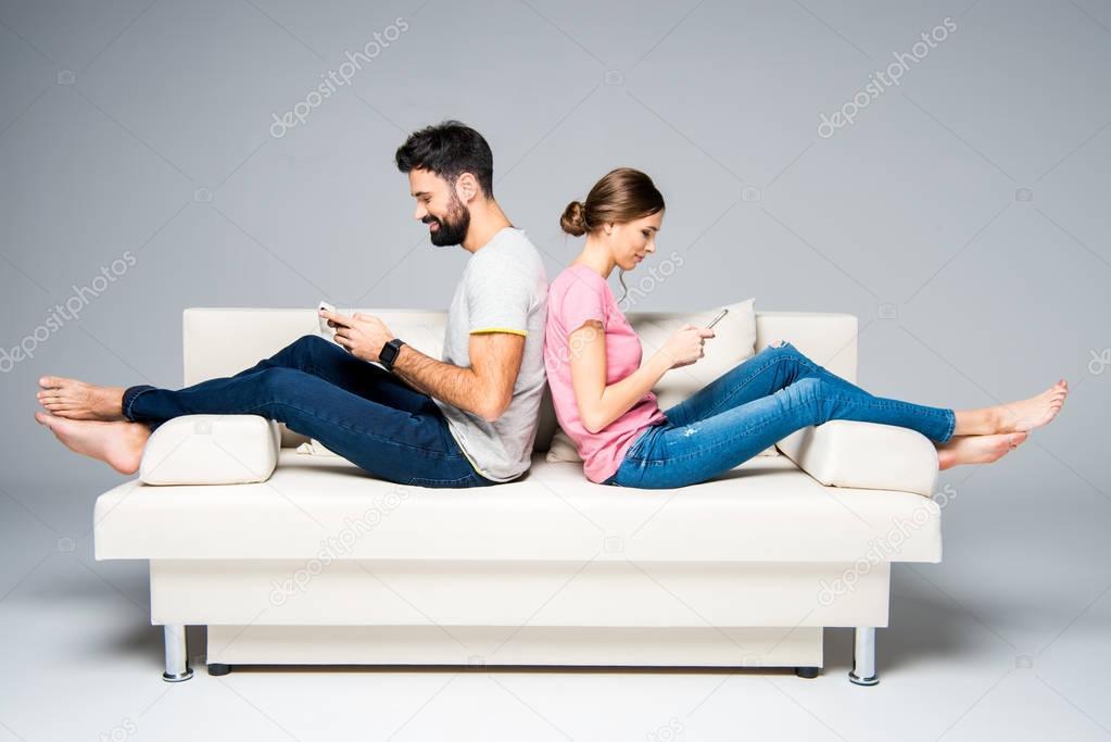 Couple using smartphones 