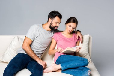 Couple reading book clipart
