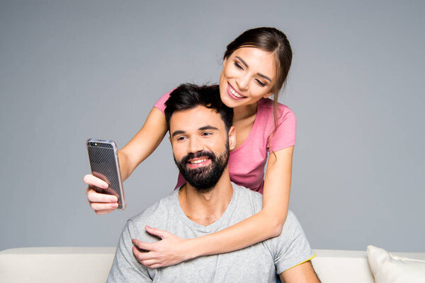 Happy couple taking selfie