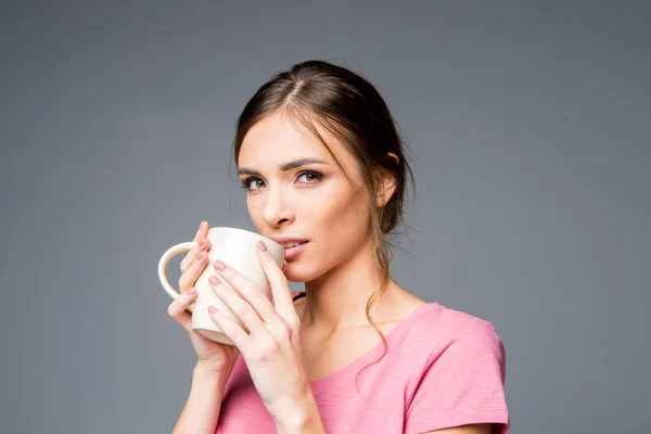 Woman holding white cup — Stock Photo, Image