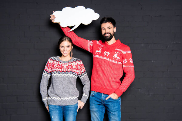 Man with speech bubble over girlfriend's head 