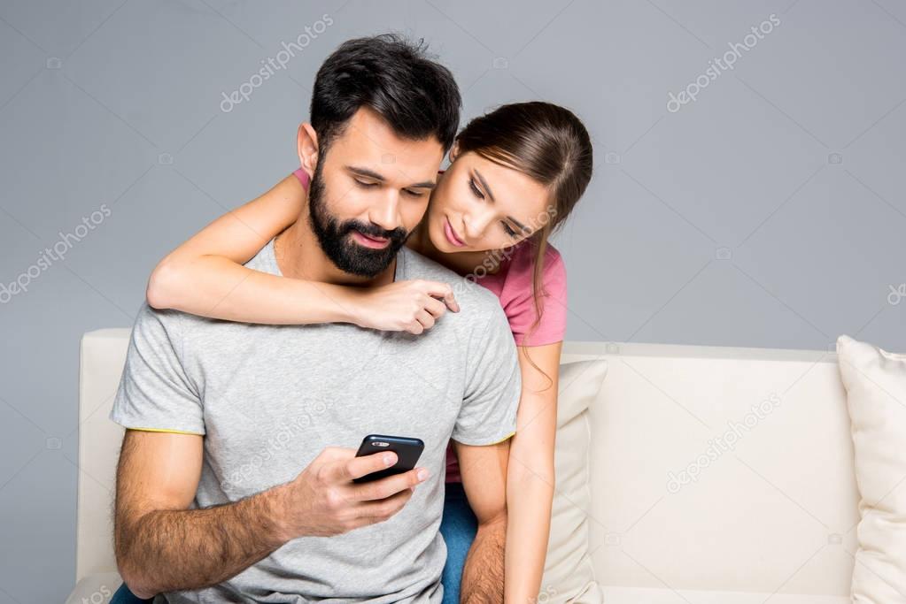 Couple using smartphone 