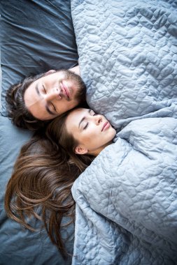 Man and woman sleeping clipart