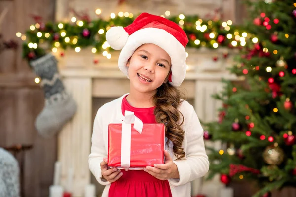 Kid holding gift box — Stock Photo