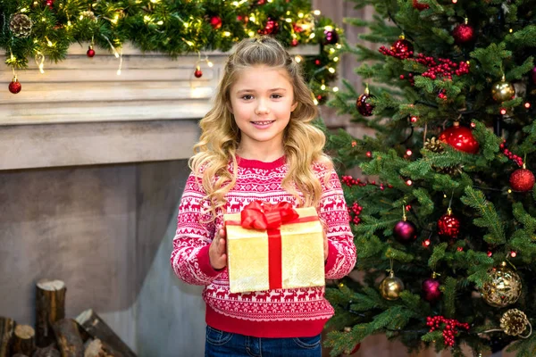 Happy child holding gift box — Stock Photo