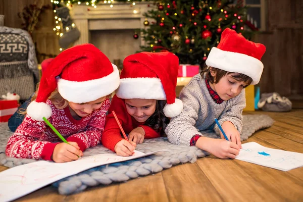 Happy children drawing picture — Stock Photo