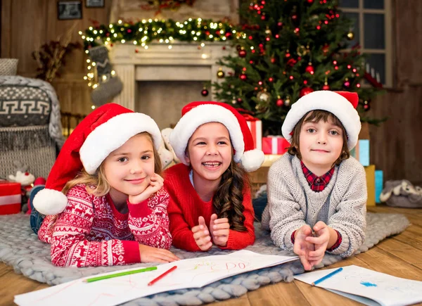 Happy kids drawing picture by markers — Stock Photo