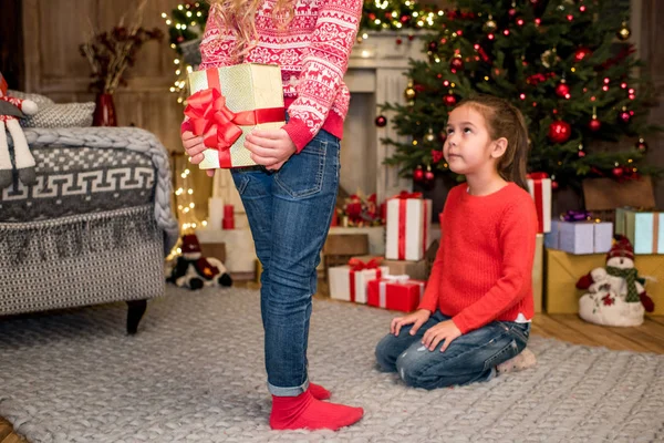 Kid ready to give gift box to friend — Stock Photo