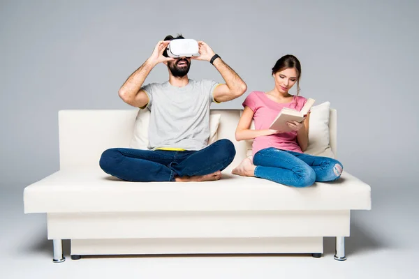 Couple resting on white couch — Stock Photo