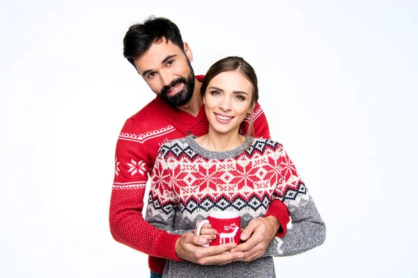 Couple holding cup — Stock Photo