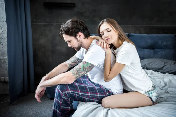 Man and woman in bedroom — Stock Photo
