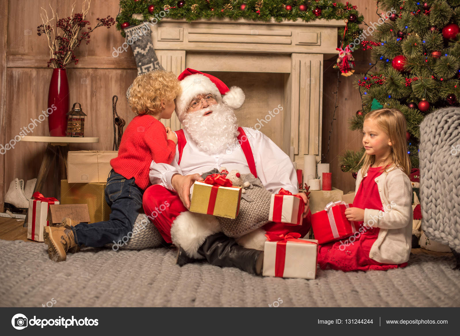 Santa Claus and children with Christmas gifts — Stock Photo