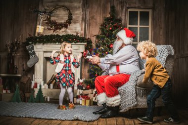 Santa Claus with children   clipart