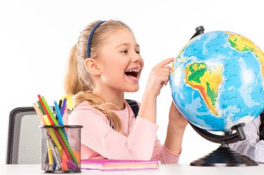 Happy schoolgirl exploring globe clipart