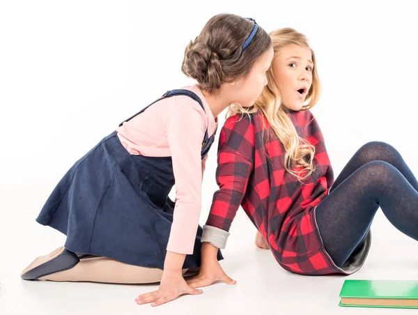 Schoolgirls sitting and talking — Stock Photo, Image