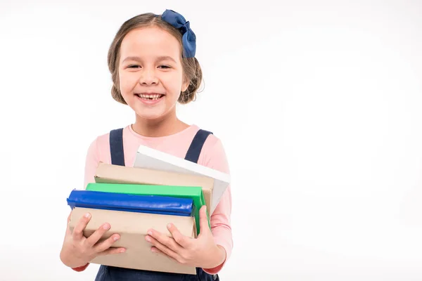 Colegiala sosteniendo libros — Foto de Stock