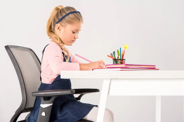 Schoolgirl doing homework — Stock Photo, Image