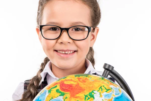 Schoolgirl smiling with globe — Stock Photo, Image