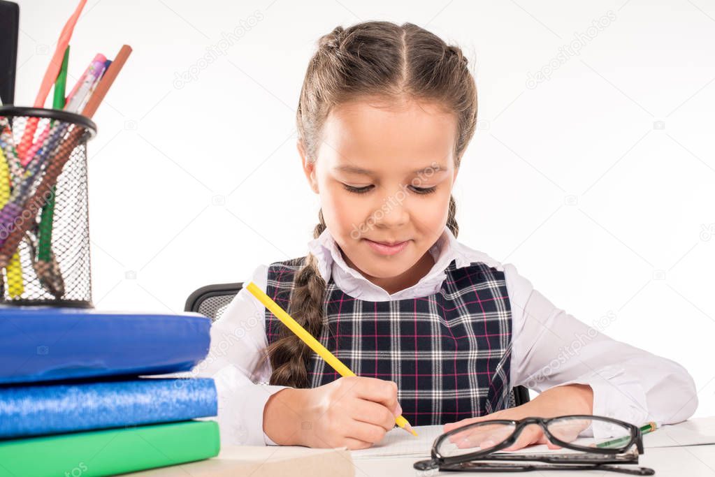 Schoolgirl writing homework 