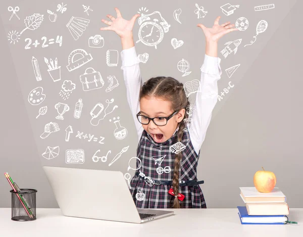 Excited schoolgirl with laptop — Stock Photo, Image