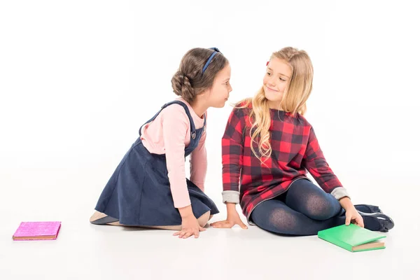 Schoolgirls sitting and talking — Stock Photo