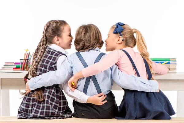 Classmates sitting at desk with books — Stock Photo