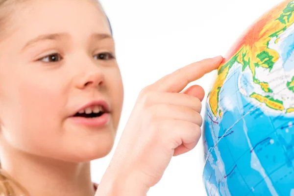 Happy schoolgirl exploring globe — Stock Photo