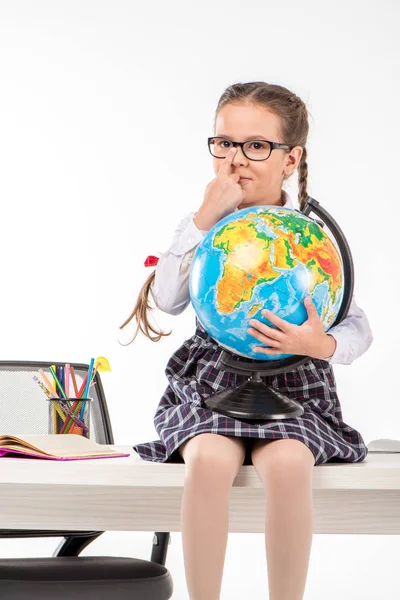 Schoolgirl holding globe — Stock Photo