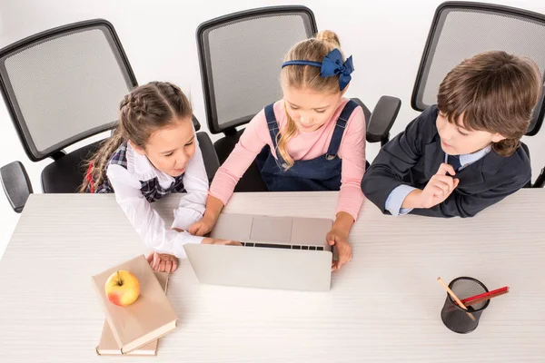 Classmates using laptop — Stock Photo