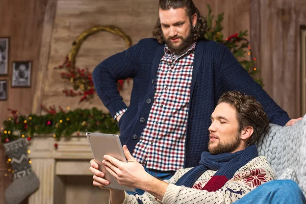 Handsome men using digital tablet — Stock Photo