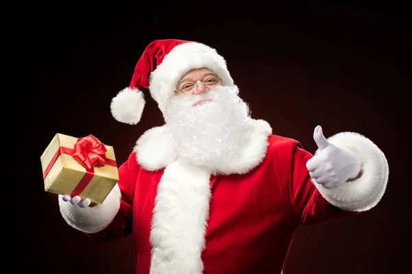 Papai Noel com caixa de presente na mão — Fotografia de Stock