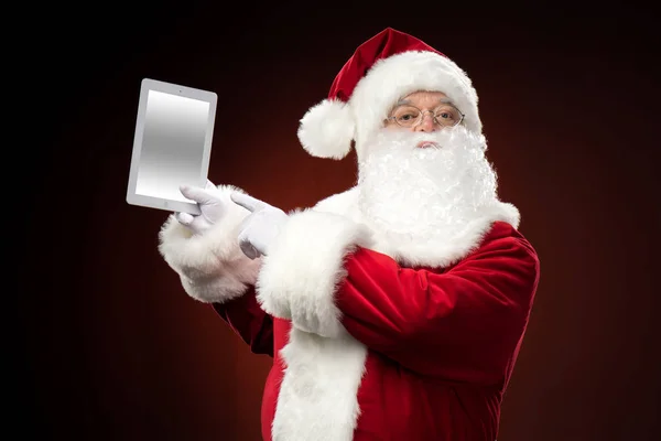 Santa Claus met digitale tablet — Stockfoto