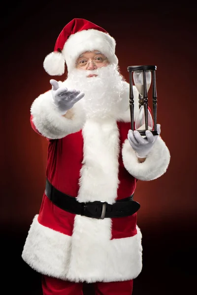 Santa Claus con reloj de arena — Foto de stock gratis