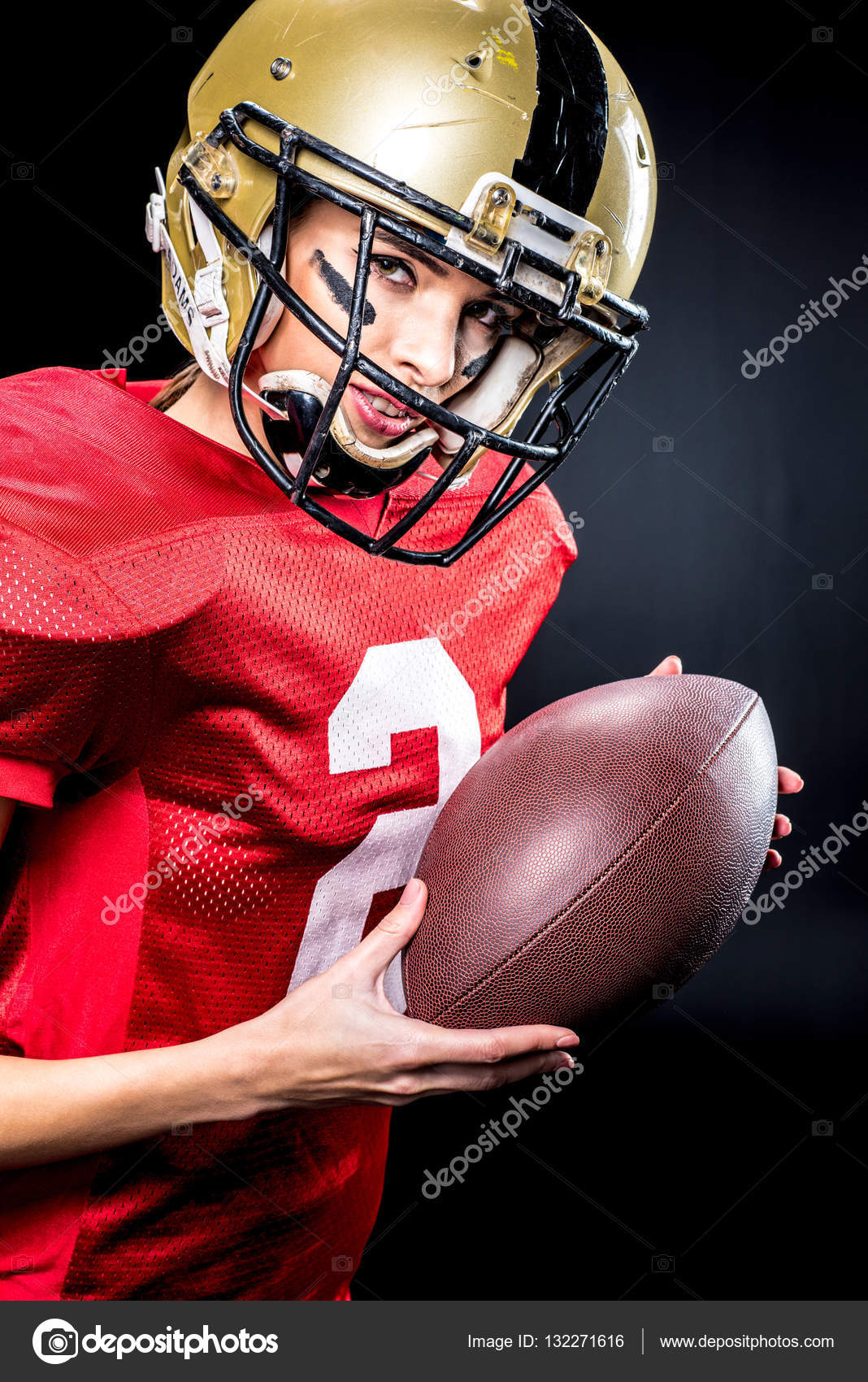Female football player in helmet Stock Photo by ©DmitryPoch 132271616