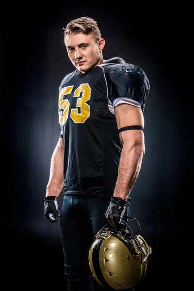 American football player holding helmet — Stock Photo, Image