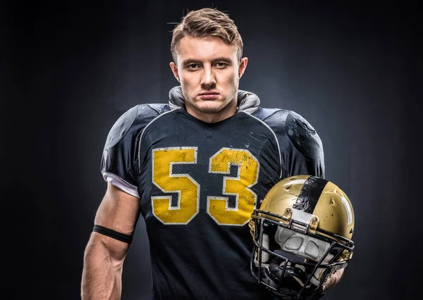 American football player holding helmet — Stock Photo, Image