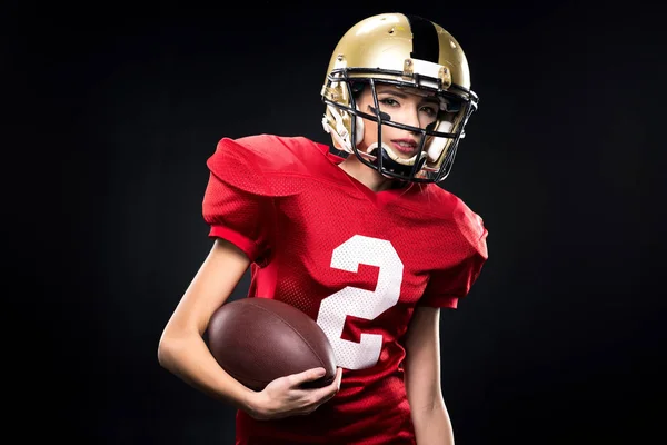 Kvinnlig amerikansk fotbollsspelare i sportkläder — Stockfoto