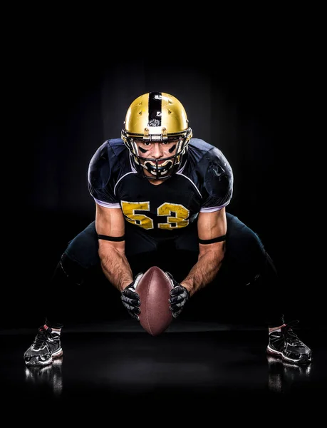 American football player holding ball — Stock Photo, Image