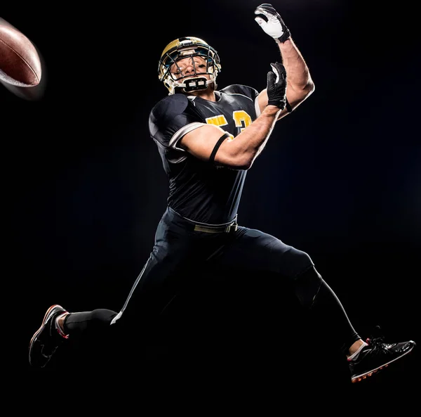 Football player catching ball — Stock Photo, Image