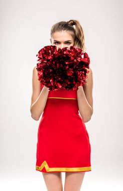 Cheerleader posing with pom-poms clipart
