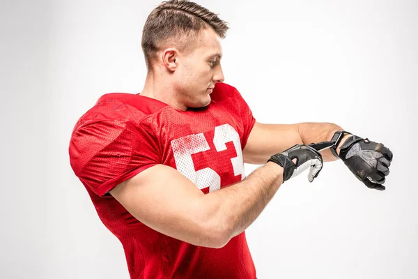 Football player pointing on smartwatch — Stock Photo, Image