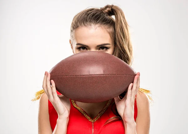 Female cheerleader with rugby ball — Stock Photo, Image