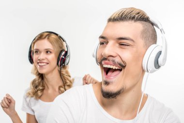 Young couple in headphones clipart