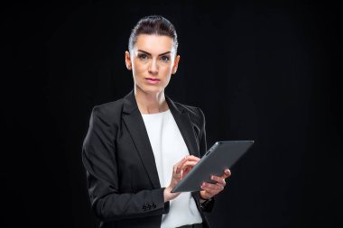 Businesswoman using digital tablet clipart