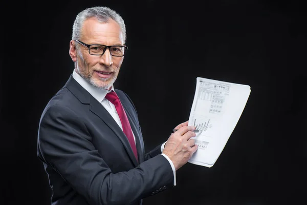 Businessman holding papers — Stock Photo, Image