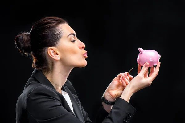Businesswoman holding piggybank — Stock Photo, Image